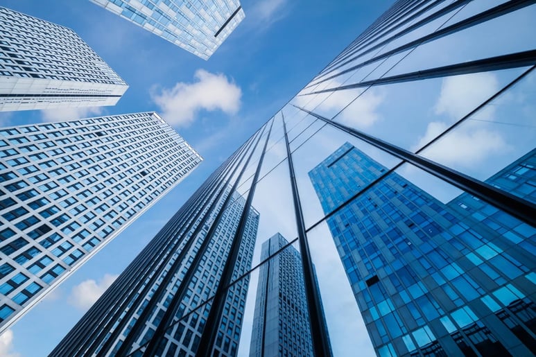 View of city skyscrapers looking upwards.