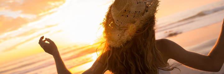 Girl at the beach at sunset.