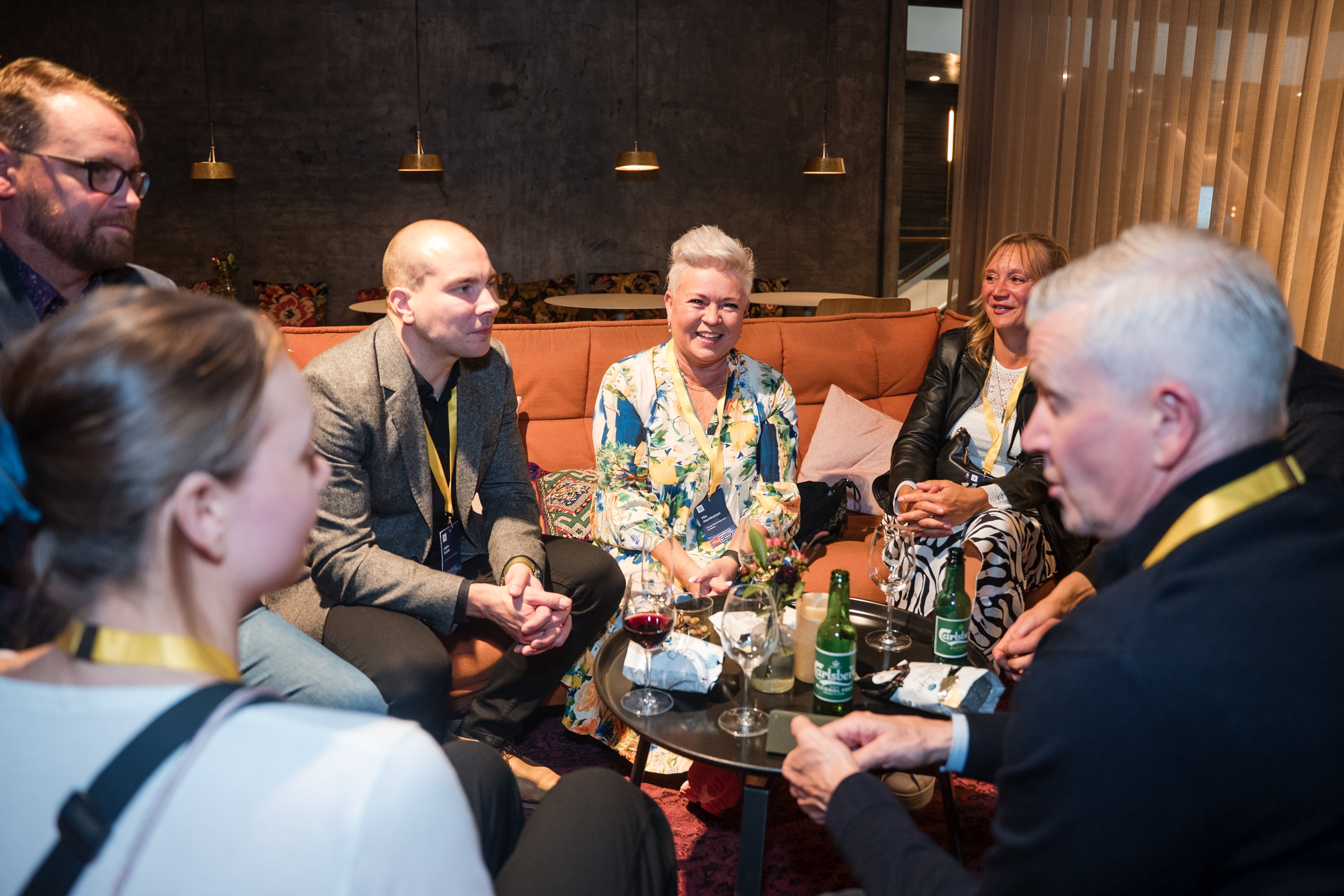 Customers in conversation at the evening reception